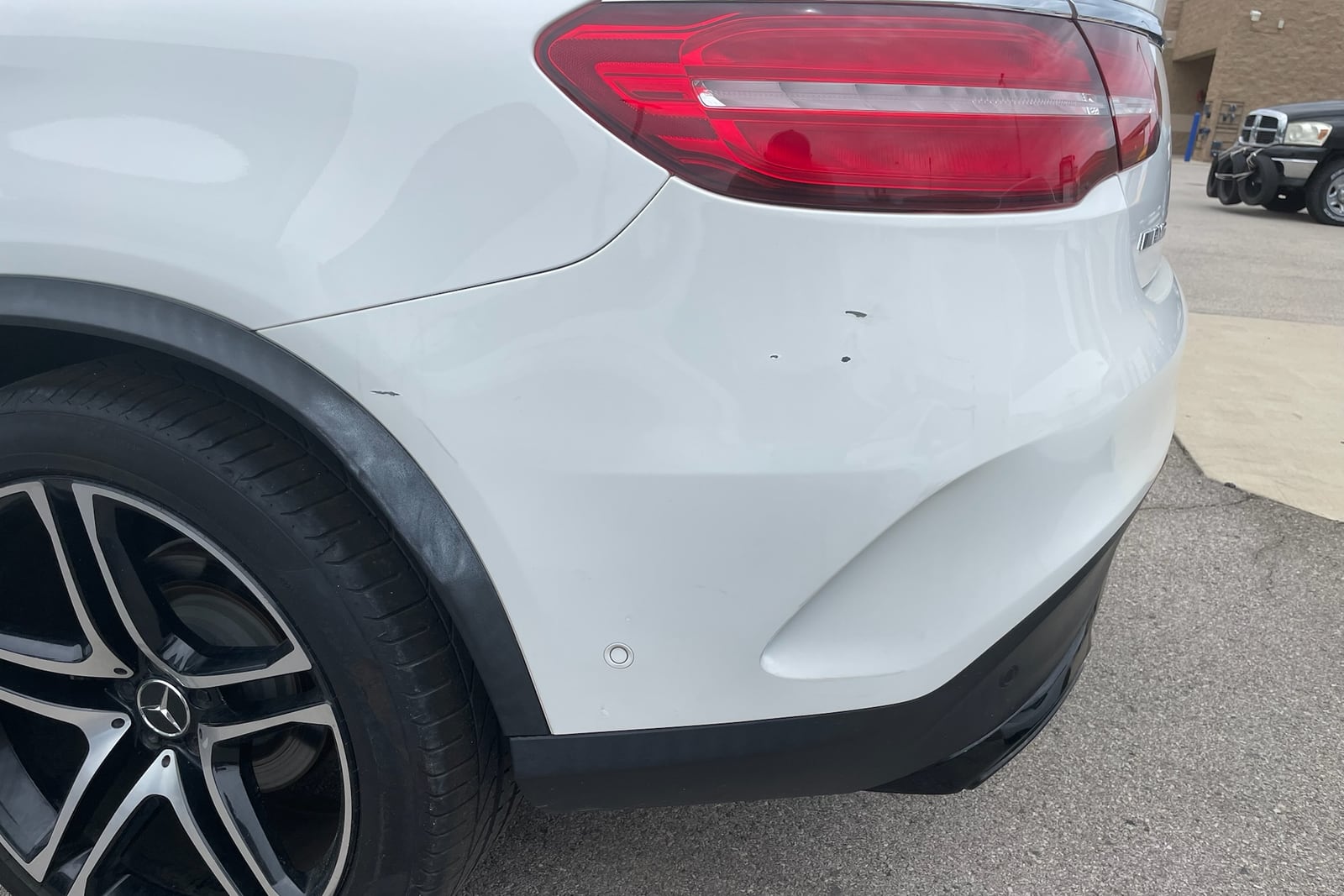 Before: Dented rear quarter panel — before and after repair by Dr. Vinyl DFW