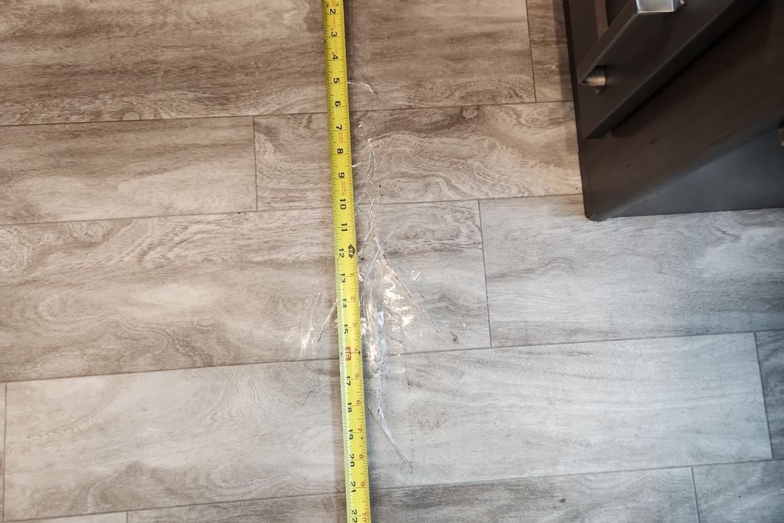 Before: Gouged vinyl flooring — before and after repair by Dr. Vinyl DFW
